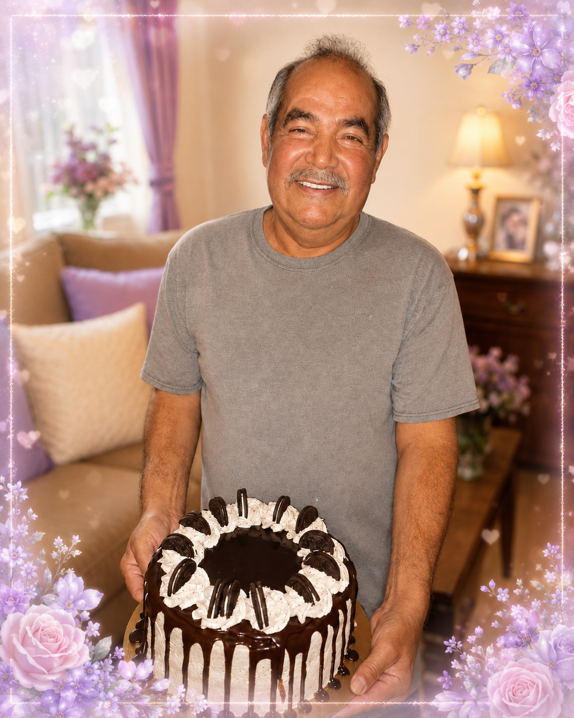 Pedro smiling while holding a decorated birthday cake